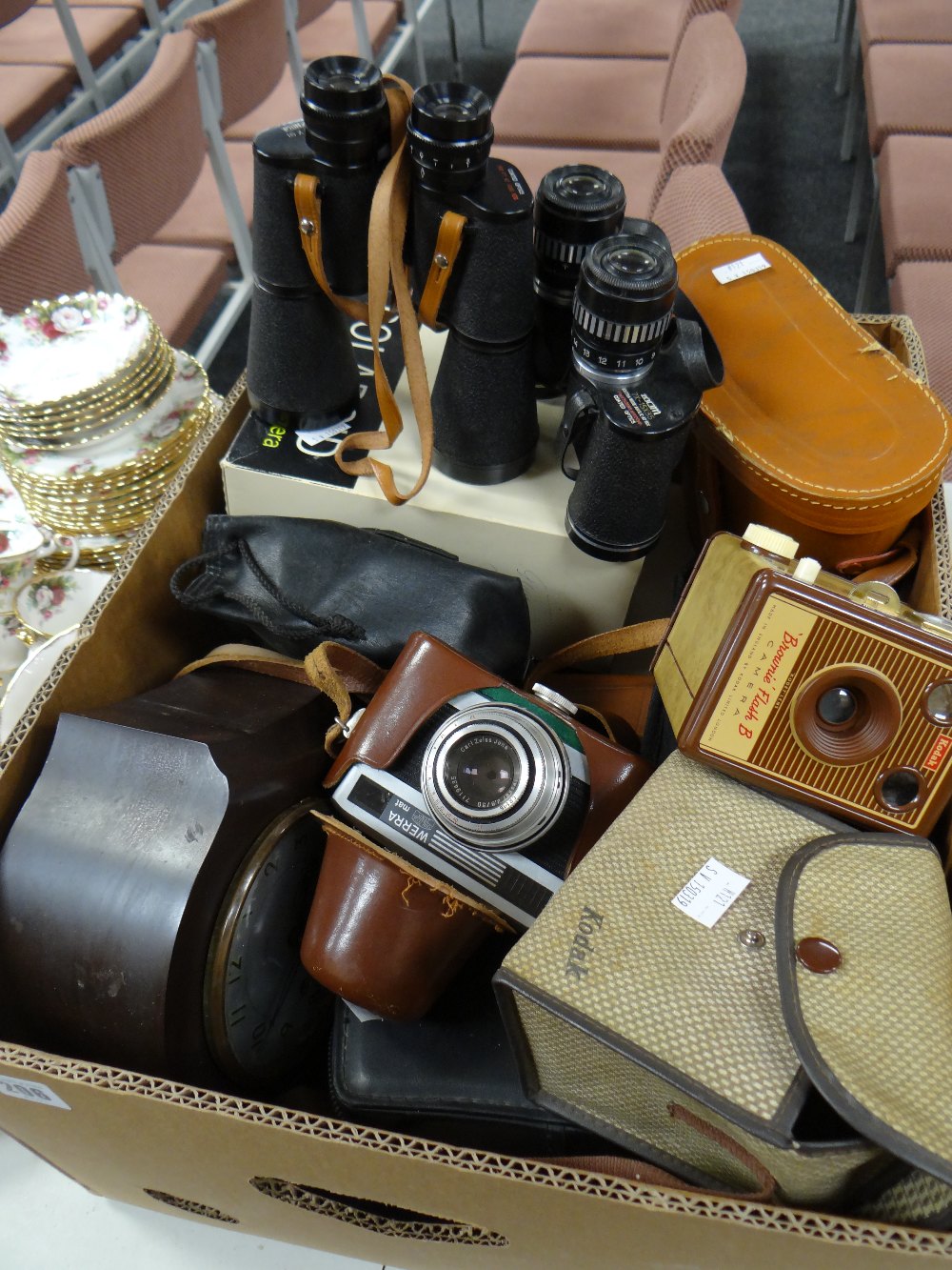 A box of various vintage cameras including Carl Zeiss Werra and others, three pairs of binoculars