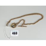 A 9ct yellow gold muff chain with t-bar and suspended compass fob in 9ct yellow gold frame, 42gms