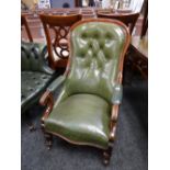 A buttoned green leather armchair with serpentine front and studded covering Condition reports