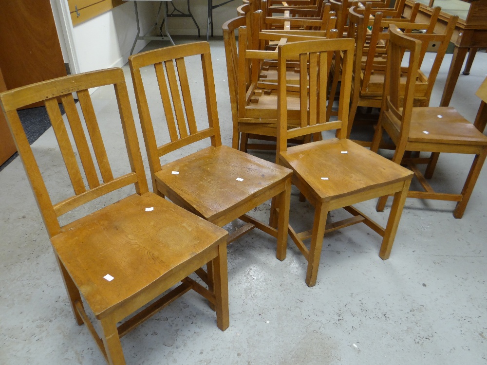 A set of twenty-six Brynmawr oak chairs of simple form with three vertical rail backs, some