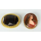 Two yellow metal brooches, one with agate, another with portrait of female (2) Condition reports