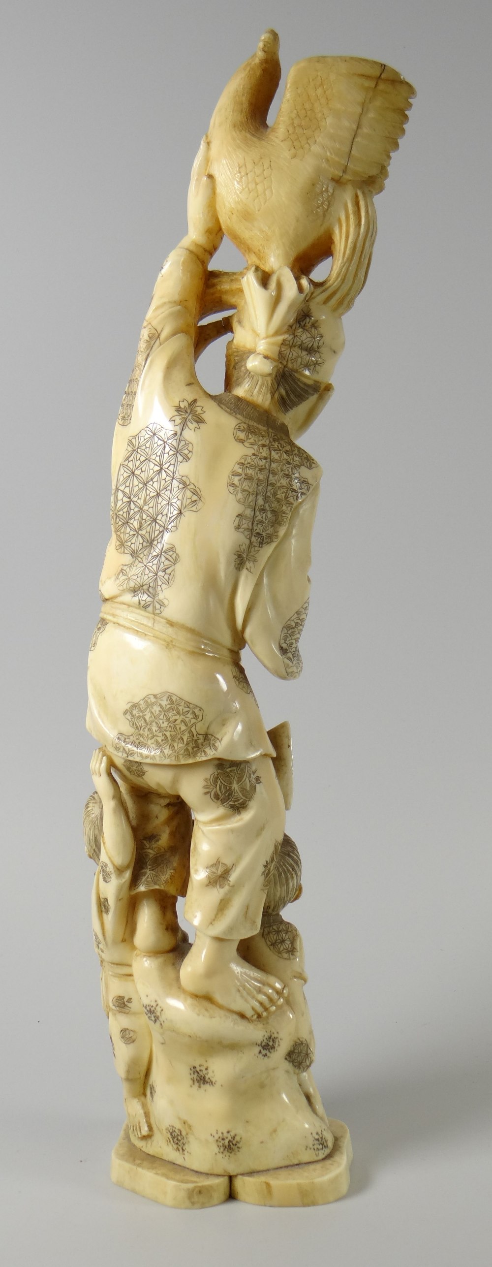 A Meiji carved ivory stack-group of a jolly father & his two children with bird atop and two - Image 2 of 3