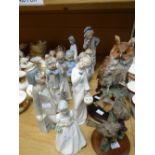 Ten Spanish factory porcelain figures including Nao together with two pottery bird sculptures