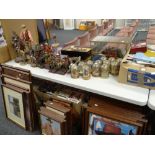 A very large collection of John Wayne merchandise including collectors plates, figurines, 'Stars &
