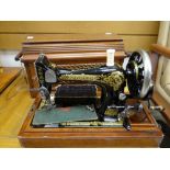 A vintage cased sewing machine Condition reports provided on request by email for this auction