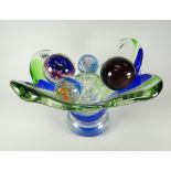 An art-glass centre dish and five twentieth century glass paperweights including Wedgwood