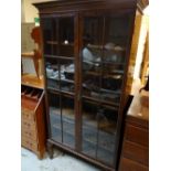 A good standing mahogany two-door glazed bookcase, 191cms h x 92cms l x 34cms d Condition reports
