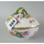 A Meissen porcelain teardrop shaped bowl and lid decorated all round with sprays of flowers with