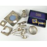 A parcel of silver including spoons, scent bottle, picture frames etc together with a cased silver-