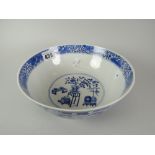 A nineteenth century Chinese porcelain footed circular bowl, the exterior decorated with Prunus, the