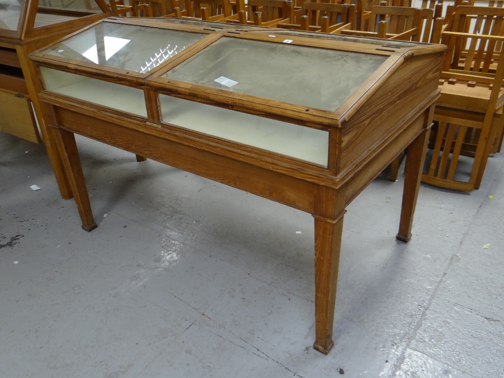 An Edmonds of Birmingham vintage museum display cabinet in table format with four hinging sloped