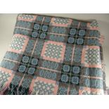 A good traditional Welsh blanket patterned in pink, powder blue and green with typical geometric