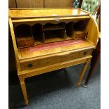 A reproduction inlaid burr-effect drum-table with base drawer on reeded supports, 102cms h x 76cms l