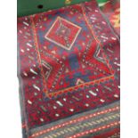 A blue and red Meshwani runner, 265 x 59cms Condition reports provided on request by email for