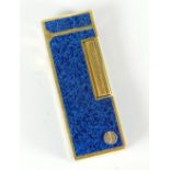 A Dunhill blue mottled enamel and yellow metal gas cigarette lighter Condition reports provided on