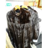 A South African dark fur long coat and another Condition reports provided on request by email for