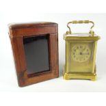 A good vintage brass carriage clock with gilt metal face and dial bearing Arabic numerals,