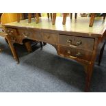 An Edwardian inlaid mahogany writing desk with tooled green leather insert-top and with a bank of