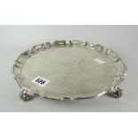 Silver pie-crust edge salver raised on four scroll feet, Glasgow 1919, maker's initials R&W S,