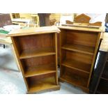 A pair of vintage light oak three-shelf open bookcases with architectural finials, 106cms h x