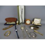 Collection of lady's and gent's wristwatches, a cased travel alarm clock, a bronze desk model of a