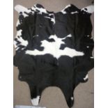 Black and white cow hide skin