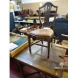 Polished draw leaf table on turned supports with a set of four Hepplewhite style dining chairs