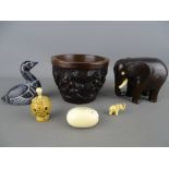 Carved African hardwood bowl and an elephant figurine, a Boma figure of a Canada goose, a 4cms