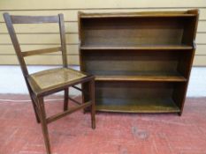 Polished wood four shelf bookcase and a small cane seated inlaid bedroom chair