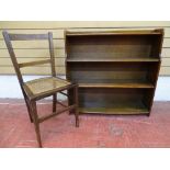 Polished wood four shelf bookcase and a small cane seated inlaid bedroom chair