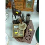 Folding carved hardwood table, two treen figures and a vase etc