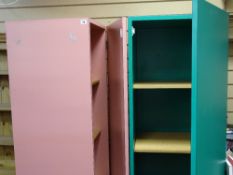 Two pink storage units with mirrors and interior multi-shelves and a matching table