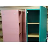 Two pink storage units with mirrors and interior multi-shelves and a matching table