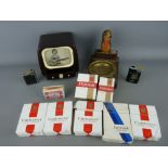 Collection of smoking memorabilia including a vintage bakelite TV cigarette box with moving view,