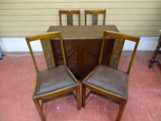 Drop leaf polished dining table and four chairs