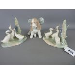 Two Nao porcelain groups of ducks and a seated spaniel with a big bow