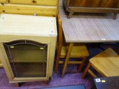 Melamine topped kitchen table, two pine chairs and a small leaded glass kitchen cupboard