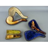 Two vintage Meerschaum and amber pipes and a cheroot holder, all cased (damages)