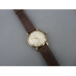 Garrard nine carat gold cased gent's wristwatch with subsidiary seconds dial on a leather strap, the