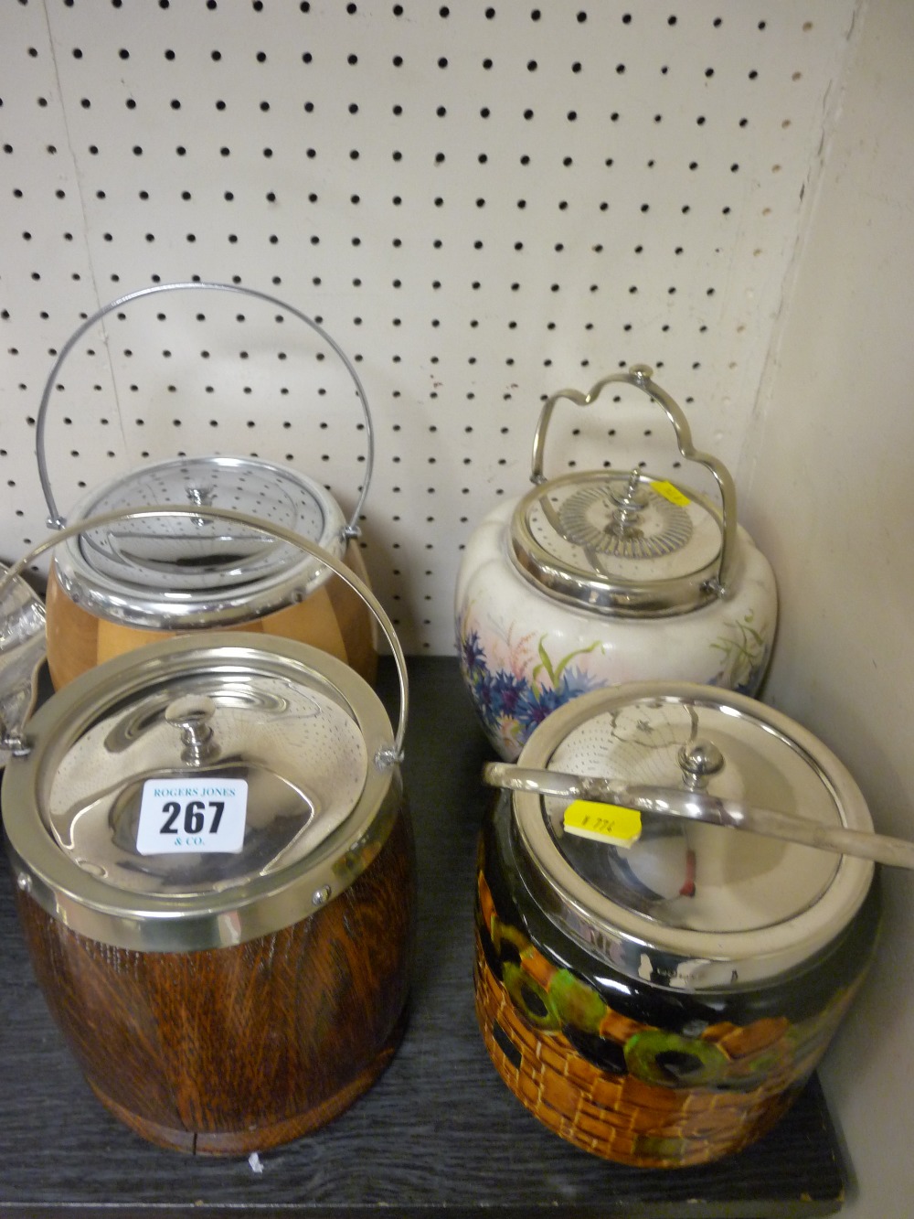 Four vintage treen and porcelain biscuit barrels