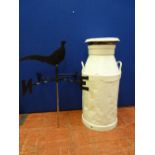White painted metal milk churn and a black finished weather vane