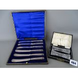 Cased set of six table knives with hallmarked silver handles and a cased pair of cut glass knife