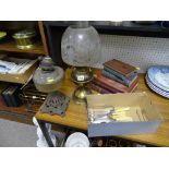 Two vintage oil lamps, one with an etched shade, small parcel of flatware and a parcel of vintage