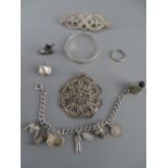 Silver charm bracelet, a filigree pendant, a child's silver bangle etc