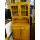 Compact modern light wood dresser with upper leaded glass doors