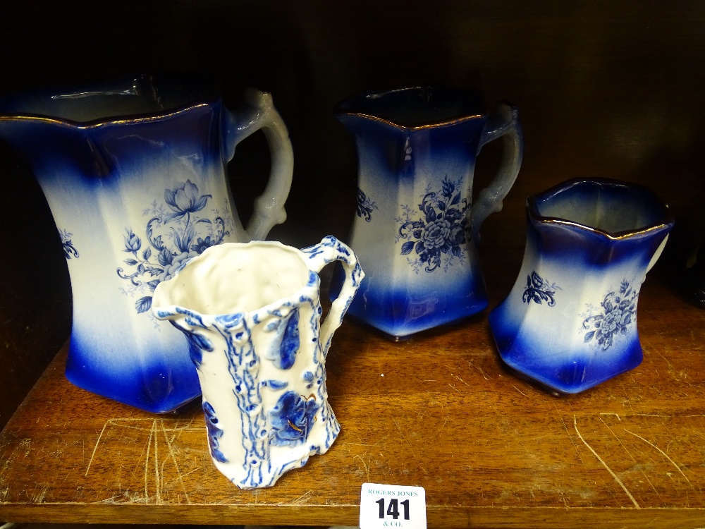 Trio of Mayfayre graduated jugs and another blue and white jug