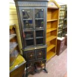 Ornate polished corner cupboard with beadwork carving