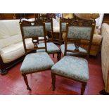 Four neatly carved Edwardian armchairs