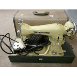 Cased Lucia pedal operated sewing machine