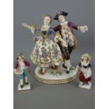 Continental porcelain group of a dandy lady and gent with a small pair of Continental figurines (